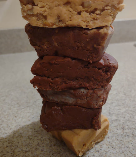 A stack of our Old-Fashioned Stovetop NOT in a microwave fudge. It's so rich and creamy that once you taste you won't be able to resist. Made in Wisconsin, available in multiple local stores and free local shipping with cheap nationwide